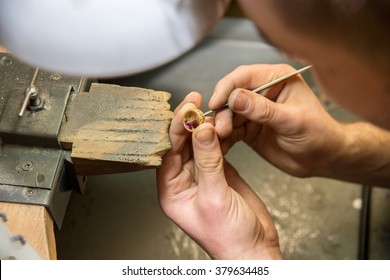 jeweler makes a piece of jewelry 