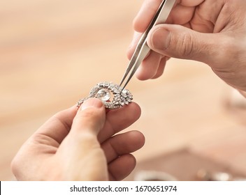Jeweler making adornment in workshop, closeup - Shutterstock ID 1670651974