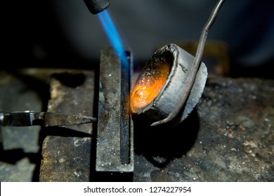 Jeweler making jewelry in a goldsmith workshop 