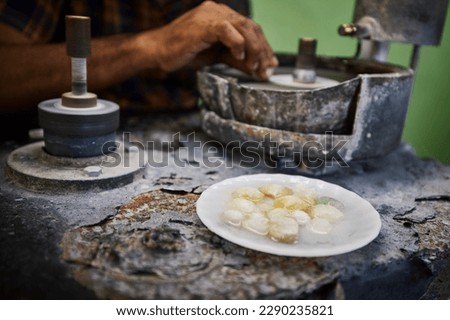 Jeweler is processing Moonstone, which is mined from mine in Sri Lanka. Jewelry is made from this unique gemstones.
