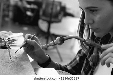 Jeweler at work, crafting in a jewelry workshop.