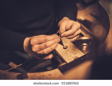 Jeweler at work in jewelery workshop. - Shutterstock ID 551885965
