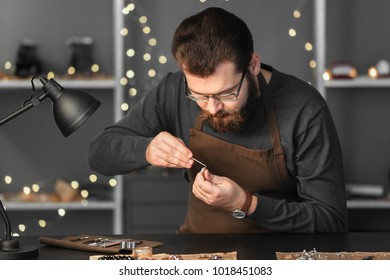 Jeweler working in workshop