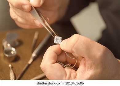 Jeweler working in workshop, closeup - Shutterstock ID 1018483606