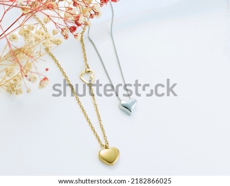 Jewelery background. Gold necklaces on background