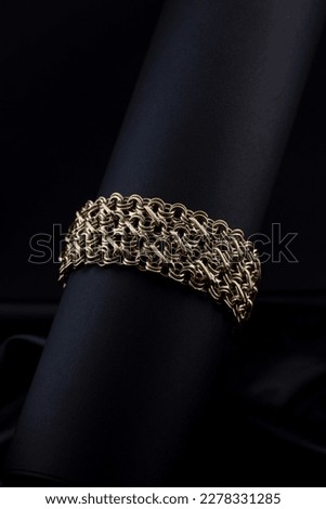 Jewelery gold bracelet close-up studio shooting