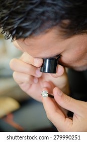 Jeweller appraising a ring