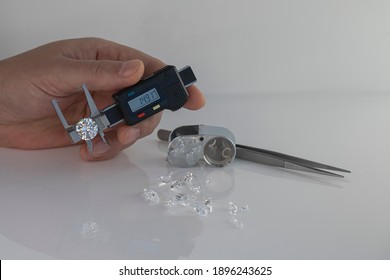 Jeweller Expert Checking Diamonds Using Gauge For Measuring Gemstone Dimensions To Carat Weight For Round Diamond. 