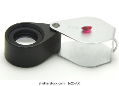 Jeweller's loupe and Unheated cut Ruby
