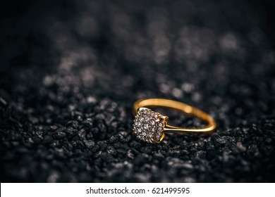 Jewellery diamond ring on a black background.