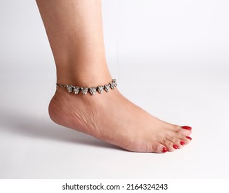Jewellery foot anklet bracelet bangle background with place for text banner. Fashion accessories.