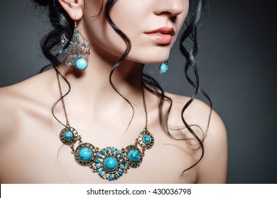 Jewellery On A Girl. Large Jewelry With Turquoise Stones. Earrings In The Form Of A Butterfly On A Girl