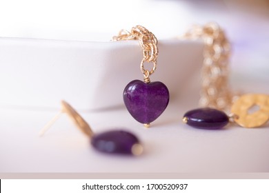 Jewellery Set Which Includes Necklace, Presented A Gold Chain With Amethyst Purple On Gold Pendant And Set Of Earrings With The Same Stone.