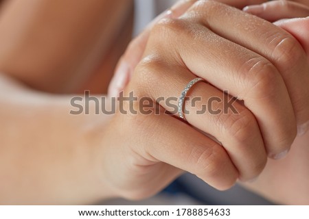 Jewellery woman. Diamond rings on young woman finger