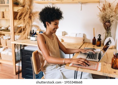 Jewelry artist working on laptop in studio. Female Ornament designer using laptop in workshop. - Powered by Shutterstock