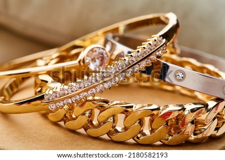 jewelry background. Gold diamond bracelets on jewelery box.