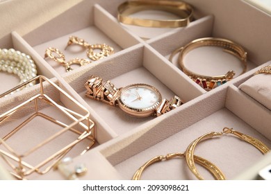 Jewelry box and stylish golden bijouterie  closeup view