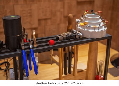 Jewelry Crafting Tools Organized on Workbench Shelf - Powered by Shutterstock