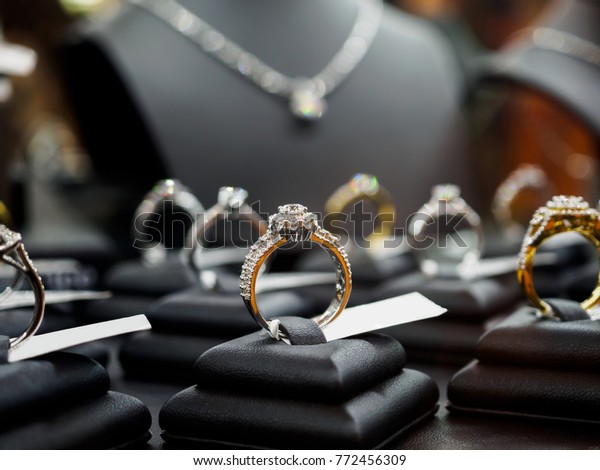 Jewelry diamond rings and necklaces show
in luxury retail store window display
showcase