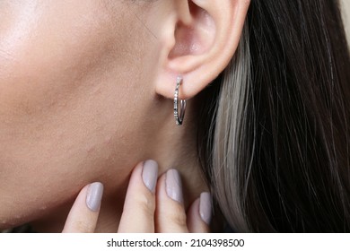 Jewelry, earrings in a beautiful girl's ear, women's accessories, gold earrings, earrings with stones, special diamonds - Shutterstock ID 2104398500