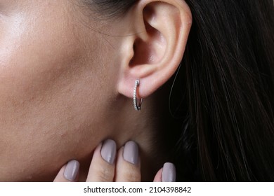 Jewelry, earrings in a beautiful girl's ear, women's accessories, gold earrings, earrings with stones, special diamonds - Shutterstock ID 2104398842