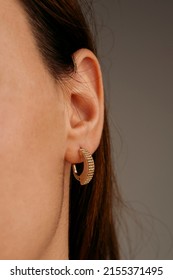Jewelry, earrings in a beautiful girl's ear, women's accessories, gold earrings, earrings with stones, special diamonds - Shutterstock ID 2155371495