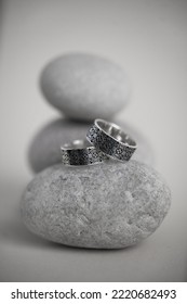 Jewelry Fashion Photography. Costume Jewelry Rings Displayed On Decorative Oval Stones, Studio Product Shot.