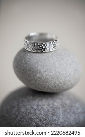 Jewelry Fashion Photography. Costume Jewelry Rings Displayed On Decorative Oval Stones, Studio Product Shot.