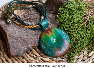 Jewelry  pendant necklace green straw support and nature decor  Handmade jewelry from polymer clay in rustic style Fashion still life 