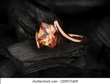 Jewelry Ring With Big Topaz Gem On Dark Coal Background