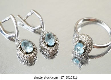 Jewelry Set With Ring And Earrings On Silver Background, Pawnshop Concept, Jewerly Shop Concept