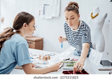 Jewelry small business, jewelry workshop. Two female professional jewelry designers making handmade jewelry in studio workshop. Crafts, fashion, creativity and handmade concept - Powered by Shutterstock