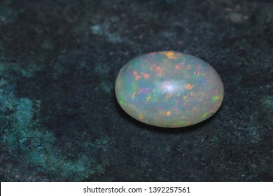 
Jewelry Stone Cabochon Opal On A Copper Background