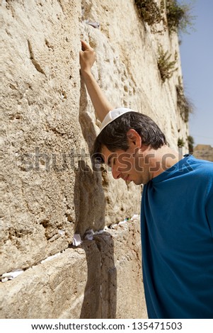 Similar – Little boy looking through the wall of a castle