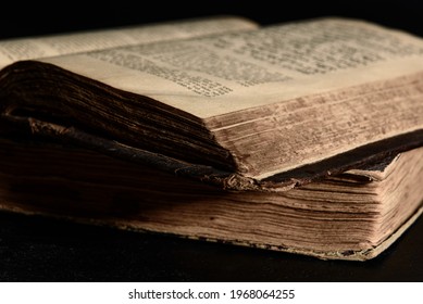 Jewish Bible. Selective focus. Old worn Jewish books. Opened scripture pages. Closeup - Shutterstock ID 1968064255