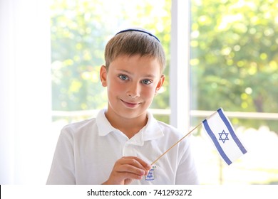 Jewish Boy With Flag At Home