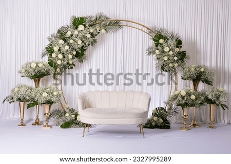 Jewish bride wedding chair, chuppah at wedding day ceremony. Bouquets Flowers and vases with chaise lounge.