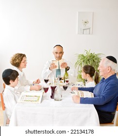 Jewish Family In Seder Celebrating Passover