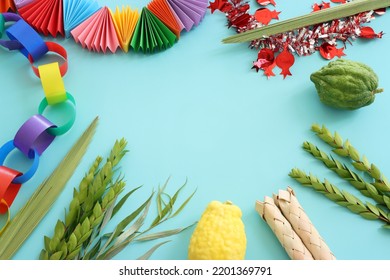 Jewish festival of Sukkot. Traditional symbols (The four species): Etrog (citron), lulav (palm branch), hadas (myrtle), arava (willow) - Shutterstock ID 2201369791