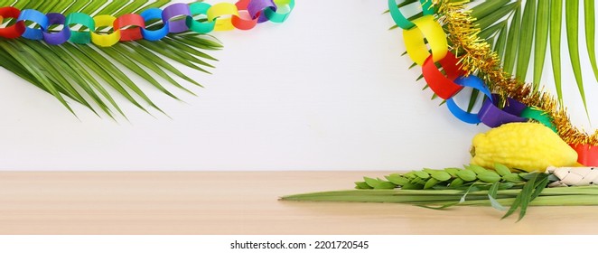 Jewish festival of Sukkot. Traditional symbols (The four species): Etrog (citron), lulav (palm branch), hadas (myrtle), arava (willow) - Shutterstock ID 2201720545