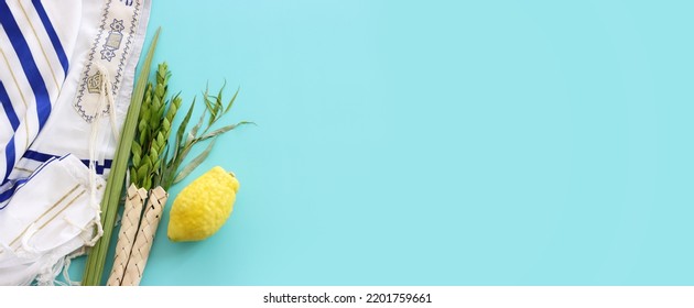 Jewish festival of Sukkot. Traditional symbols (The four species): Etrog (citron), lulav (palm branch), hadas (myrtle), arava (willow) - Shutterstock ID 2201759661