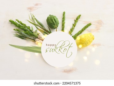 Jewish festival of Sukkot. Traditional symbols (The four species): Etrog (citron), lulav (palm branch), hadas (myrtle), arava (willow) - Shutterstock ID 2204571375