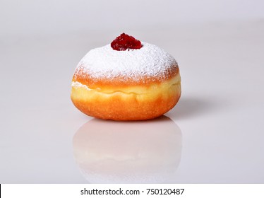 jewish food holiday Hanukkah symbol image of donut with jelly and sugar powder. isolated .