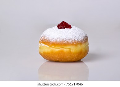 jewish food holiday Hanukkah symbol image of donut with jelly and sugar powder. isolated . DESSERT 