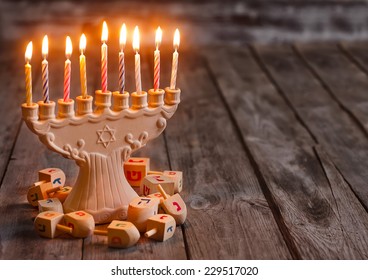 Jewish Holiday Hannukah Symbols - Menorah And Wooden Dreidels. C