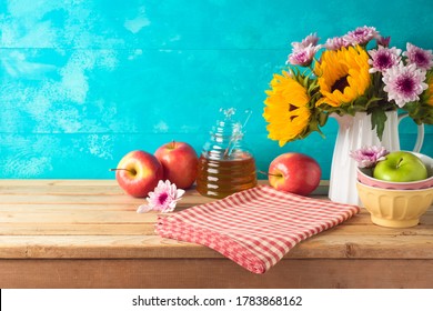 Jewish Holiday Rosh Hashana Background With Honey Jar, Apples And Sunflowers On Wooden Table. Kitchen Counter With Tablecloth And Copy Space For Product Display