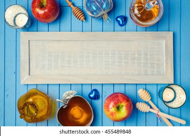 Jewish Holiday Rosh Hashana Background With Wooden Board, Honey And Apples On Table. View From Above. Flat Lay