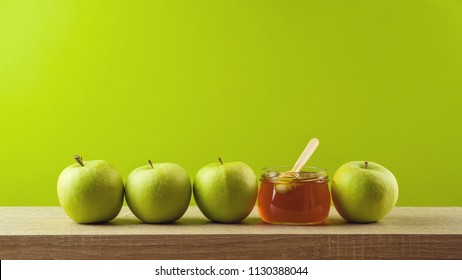 Jewish Holiday Rosh Hashanah Background With Honey And Apples On Wooden Table. 