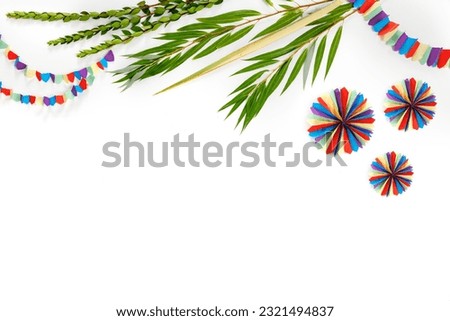 Jewish holiday of Sukkot. Traditional symbols  (citron), lulav (palm branch), hadas (myrtle), arava (willow), colorful decorations