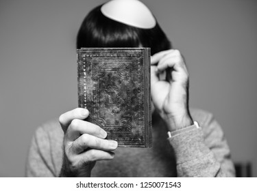 Jewish Male Wearing Kippah Praying Mahzor Prayer Book From 1920 Used On The High Holy Days Of Rosh Hashanah And Yom Kippur - Black And Whtie